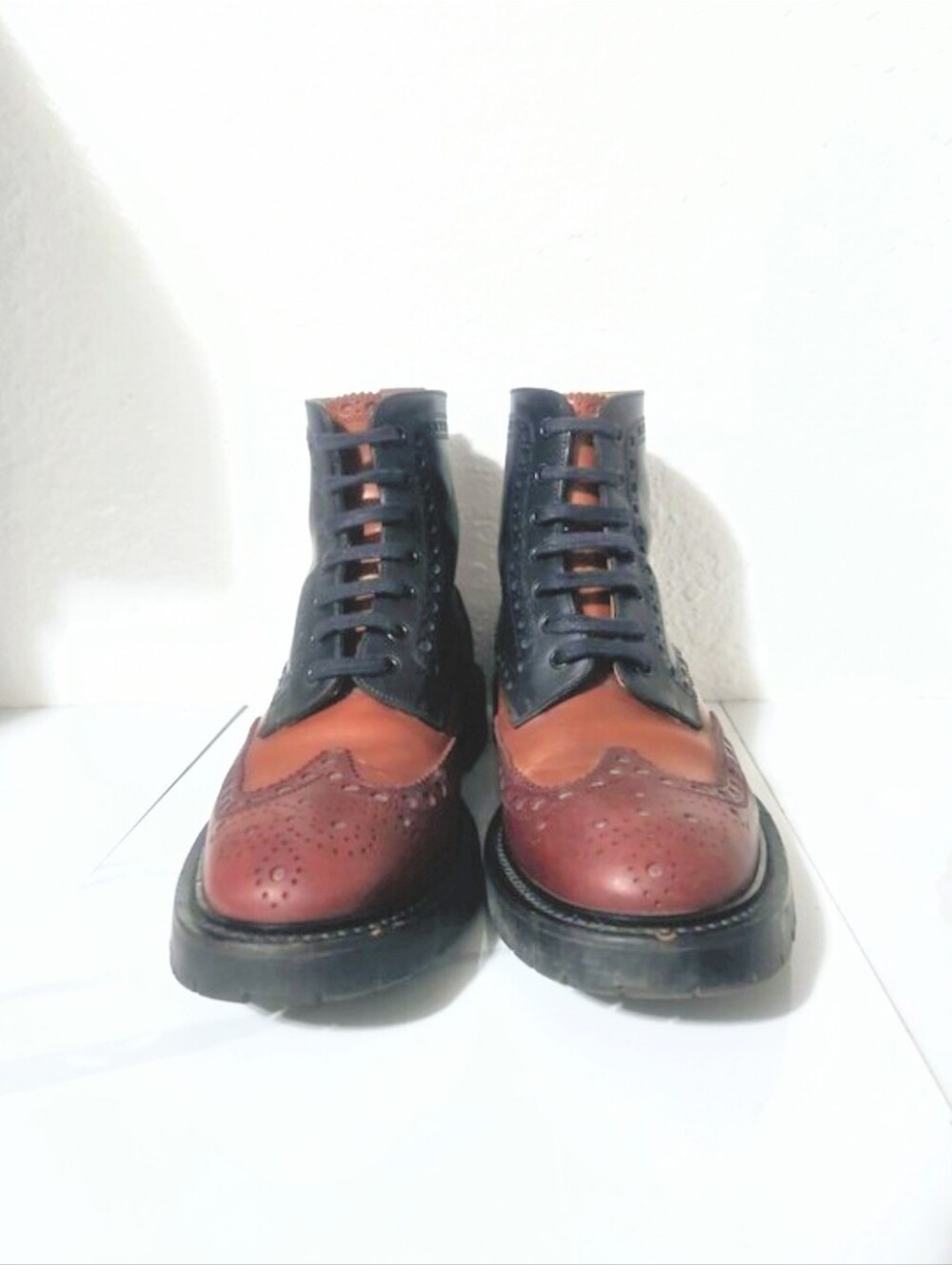Burberry Barkeston tricolor leather combat boots featuring a wingtip brogue toe
